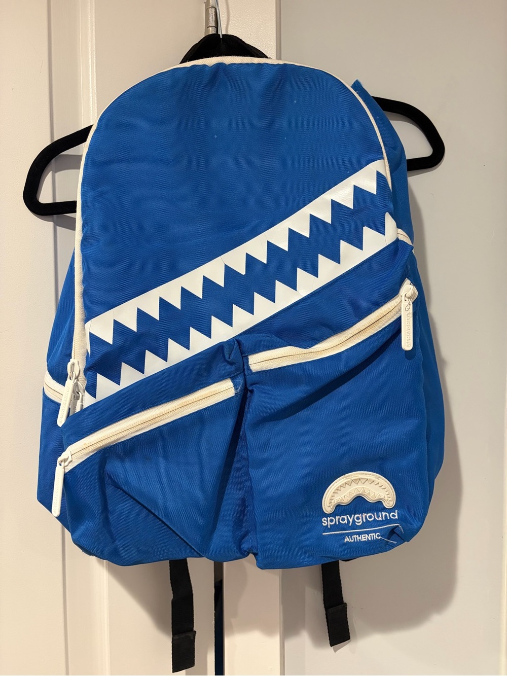Sprayground Blue Backpack with White Shark Stripe